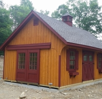14x24 Patriot Quaker with Board N Batton Siding Upgraded carrige doors Eye Brows in Door Trim Shutter Combo 12 Lite rodding doors Pine Windows