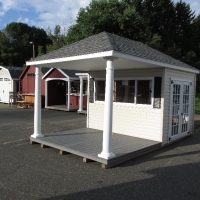 10' x 16' Avalom  with serving window, hinged counter, Treks porch, vinyl siding and 15 lite doors