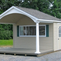 10 x 16 Avalon  , 1/2 porch 1/2 house, 2 8" round columns, trek porch, 3 x 8 serving window with hinged counter, arched front, finished porch ceiling