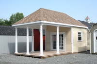 12x20 Avalon poolhouse with taller walls and higher pitch, extra columns with 15 lite prehung doors and Trek floor