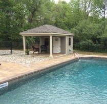 12x16 Avalon with t-1-11 siding, Trek porch, custom almond vinyl posts