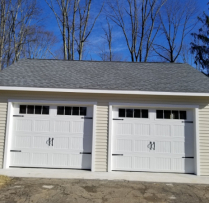 20x24 7 Pitch Truss Garage With 9 lite Door and Vinyl siding and Glass Inserts in Garage Door Extra 24x36 Window with Trim