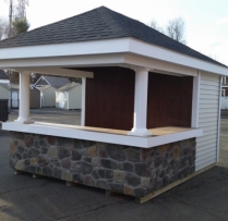 10 x 12 Siesta with vinyl siding cobble stone bar front, with tile countertop and stained back wall