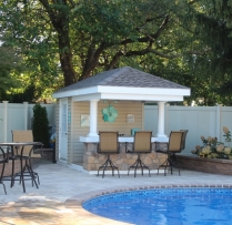 8x12 Siesta with vinyl siding, 2' overhang and cobble stone bar front