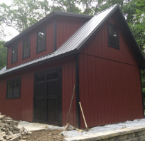 14x24 12 Pitch 2 Story Patriot 9' Garage Door Vented Soffit Upgrade Bottom 2 windows to 30x36 with trim Transom in Double Door Metal Roof 16' Long House Dormer